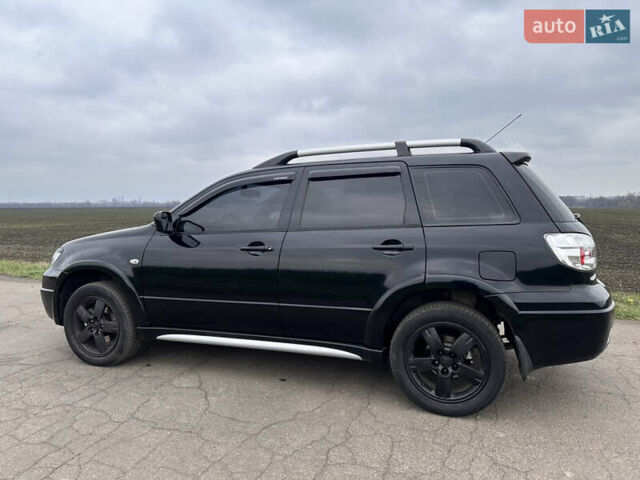 Черный Мицубиси Аутлендер, объемом двигателя 2 л и пробегом 230 тыс. км за 6300 $, фото 5 на Automoto.ua
