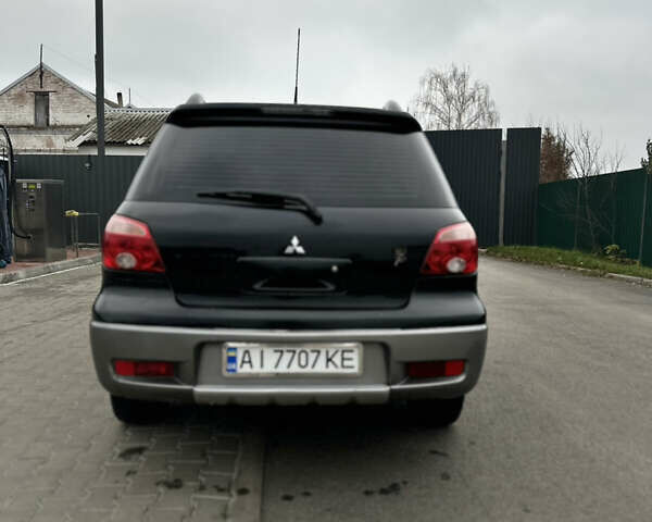 Чорний Міцубісі Аутлендер, об'ємом двигуна 2 л та пробігом 297 тис. км за 6200 $, фото 6 на Automoto.ua