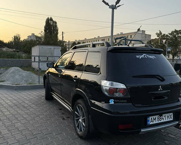 Чорний Міцубісі Аутлендер, об'ємом двигуна 2.4 л та пробігом 220 тис. км за 7777 $, фото 2 на Automoto.ua