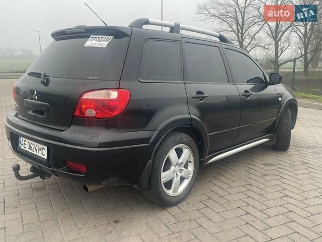 Черный Мицубиси Аутлендер, объемом двигателя 2.4 л и пробегом 277 тыс. км за 6700 $, фото 3 на Automoto.ua