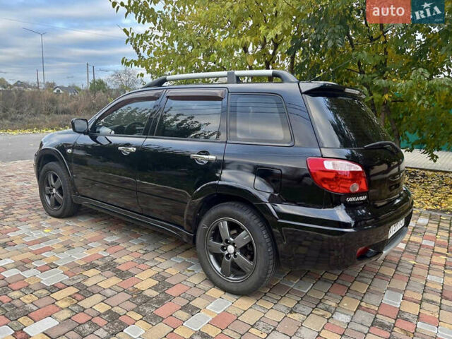 Чорний Міцубісі Аутлендер, об'ємом двигуна 2.38 л та пробігом 247 тис. км за 5499 $, фото 11 на Automoto.ua
