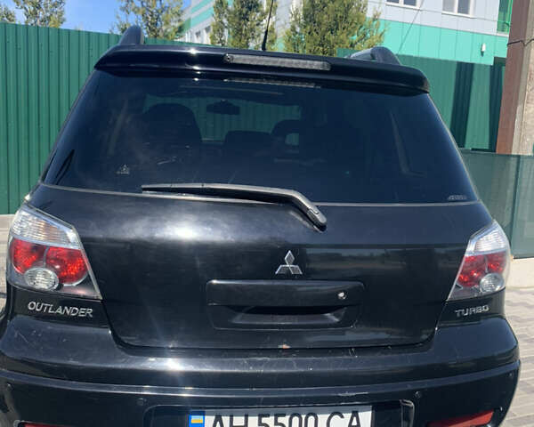 Черный Мицубиси Аутлендер, объемом двигателя 2 л и пробегом 212 тыс. км за 6000 $, фото 23 на Automoto.ua