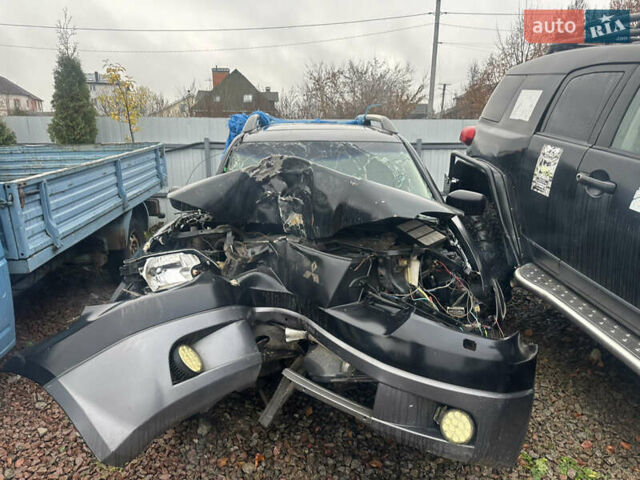 Черный Мицубиси Аутлендер, объемом двигателя 2.4 л и пробегом 240 тыс. км за 2200 $, фото 4 на Automoto.ua