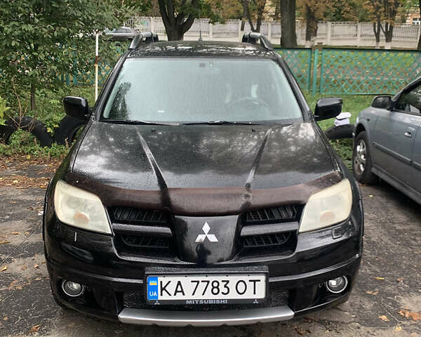 Черный Мицубиси Аутлендер, объемом двигателя 2.4 л и пробегом 200 тыс. км за 7000 $, фото 9 на Automoto.ua