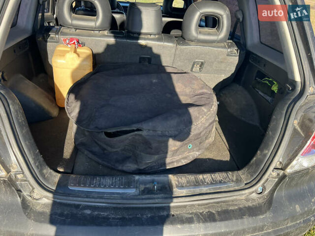 Черный Мицубиси Аутлендер, объемом двигателя 2.38 л и пробегом 230 тыс. км за 5350 $, фото 12 на Automoto.ua