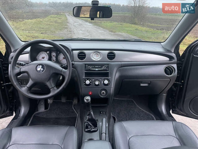 Черный Мицубиси Аутлендер, объемом двигателя 2 л и пробегом 130 тыс. км за 6999 $, фото 25 на Automoto.ua
