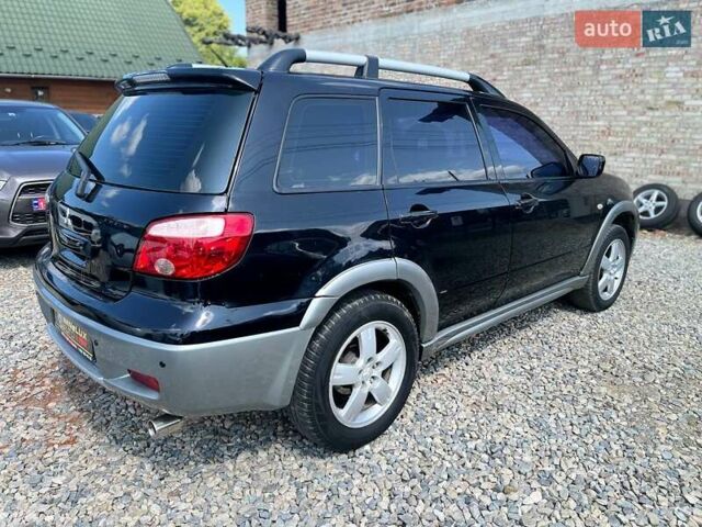 Черный Мицубиси Аутлендер, объемом двигателя 2.4 л и пробегом 270 тыс. км за 5999 $, фото 6 на Automoto.ua
