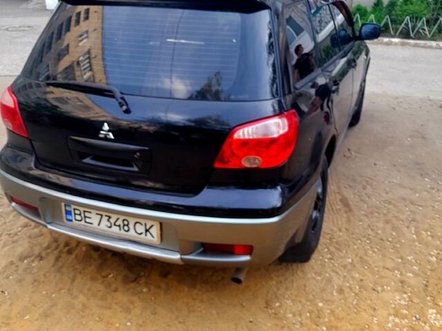 Черный Мицубиси Аутлендер, объемом двигателя 2 л и пробегом 226 тыс. км за 7000 $, фото 3 на Automoto.ua