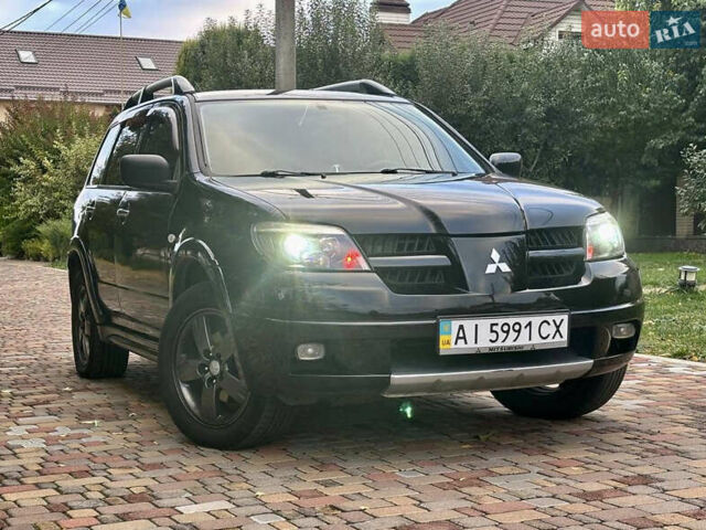 Чорний Міцубісі Аутлендер, об'ємом двигуна 2.38 л та пробігом 247 тис. км за 5499 $, фото 38 на Automoto.ua
