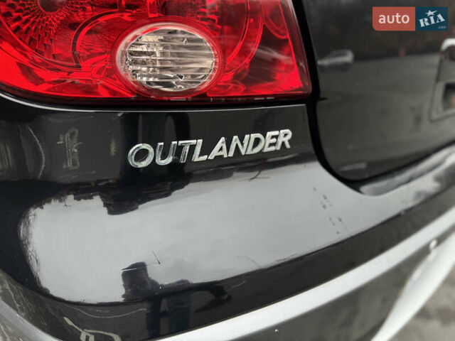 Черный Мицубиси Аутлендер, объемом двигателя 2.4 л и пробегом 242 тыс. км за 6800 $, фото 18 на Automoto.ua