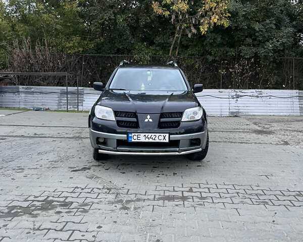 Черный Мицубиси Аутлендер, объемом двигателя 2 л и пробегом 280 тыс. км за 4999 $, фото 4 на Automoto.ua