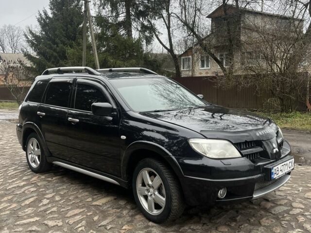 Черный Мицубиси Аутлендер, объемом двигателя 2.4 л и пробегом 310 тыс. км за 5300 $, фото 5 на Automoto.ua