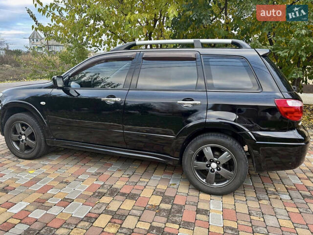 Чорний Міцубісі Аутлендер, об'ємом двигуна 2.38 л та пробігом 247 тис. км за 5499 $, фото 10 на Automoto.ua