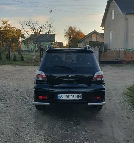 Міцубісі Аутлендер 2006 у Івано-Франківську на Automoto.ua Чорний Міцубісі Аутлендер, об'ємом двигуна 2 л та пробігом 263 тис. км за 7250 $, фото 15 на Automoto.ua