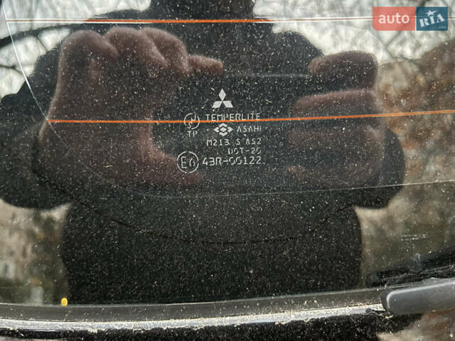 Чорний Міцубісі Аутлендер, об'ємом двигуна 2.38 л та пробігом 247 тис. км за 5499 $, фото 74 на Automoto.ua