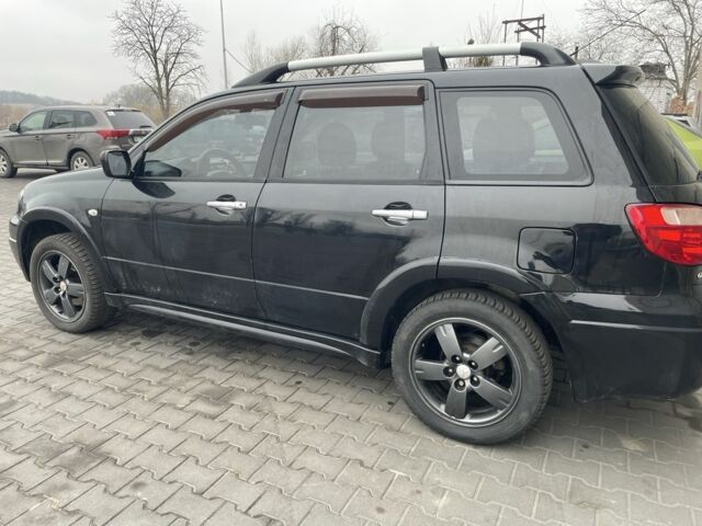 Черный Мицубиси Аутлендер, объемом двигателя 2.4 л и пробегом 234 тыс. км за 5499 $, фото 14 на Automoto.ua