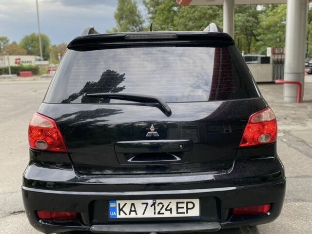 Чорний Міцубісі Аутлендер, об'ємом двигуна 2.4 л та пробігом 239 тис. км за 4200 $, фото 4 на Automoto.ua