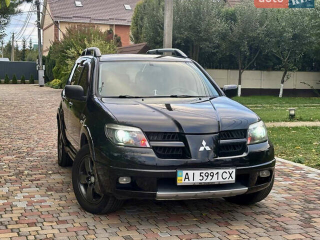 Чорний Міцубісі Аутлендер, об'ємом двигуна 2.38 л та пробігом 247 тис. км за 5499 $, фото 36 на Automoto.ua