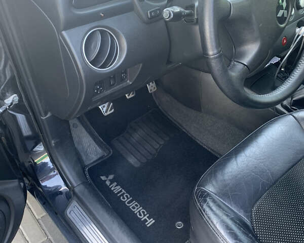 Черный Мицубиси Аутлендер, объемом двигателя 2 л и пробегом 212 тыс. км за 6000 $, фото 19 на Automoto.ua