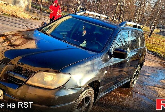 Чорний Міцубісі Аутлендер, об'ємом двигуна 2 л та пробігом 300 тис. км за 5000 $, фото 1 на Automoto.ua