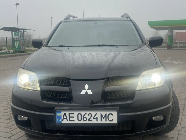 Чорний Міцубісі Аутлендер, об'ємом двигуна 2.4 л та пробігом 277 тис. км за 6700 $, фото 2 на Automoto.ua