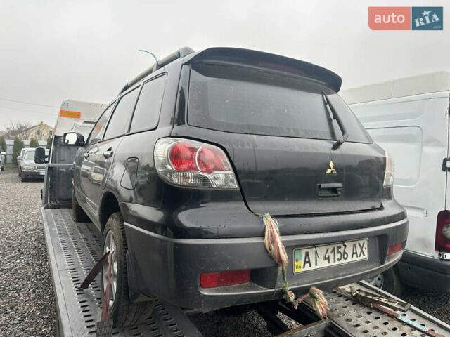 Черный Мицубиси Аутлендер, объемом двигателя 2.4 л и пробегом 240 тыс. км за 2200 $, фото 14 на Automoto.ua