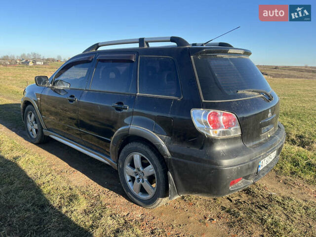Черный Мицубиси Аутлендер, объемом двигателя 2.38 л и пробегом 230 тыс. км за 5350 $, фото 5 на Automoto.ua