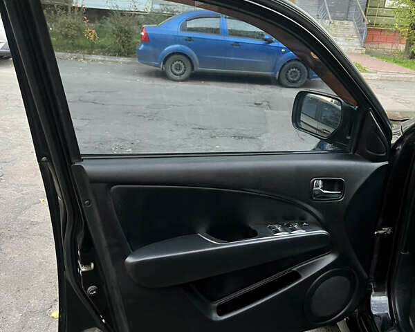 Чорний Міцубісі Аутлендер, об'ємом двигуна 2.38 л та пробігом 247 тис. км за 5499 $, фото 44 на Automoto.ua