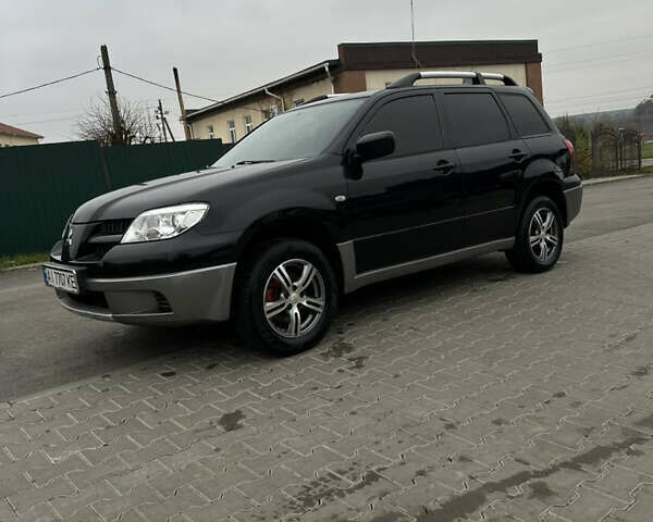 Чорний Міцубісі Аутлендер, об'ємом двигуна 2 л та пробігом 297 тис. км за 6200 $, фото 4 на Automoto.ua