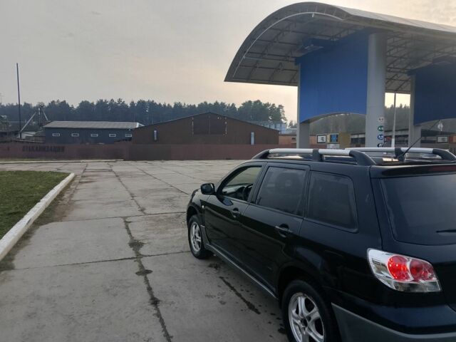 Черный Мицубиси Аутлендер, объемом двигателя 2 л и пробегом 169 тыс. км за 3500 $, фото 4 на Automoto.ua