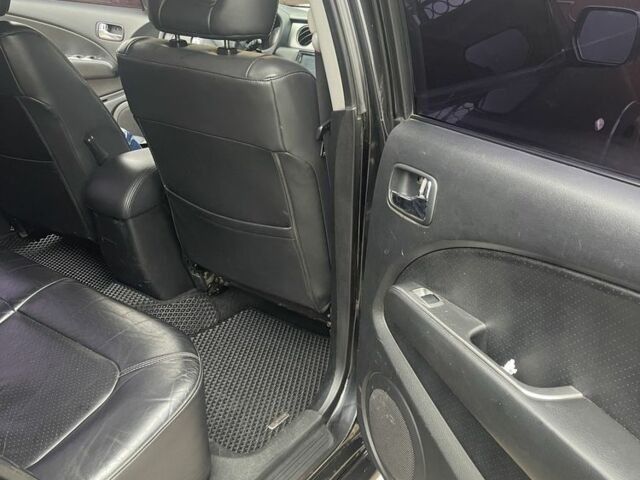 Чорний Міцубісі Аутлендер, об'ємом двигуна 2.4 л та пробігом 277 тис. км за 6700 $, фото 10 на Automoto.ua