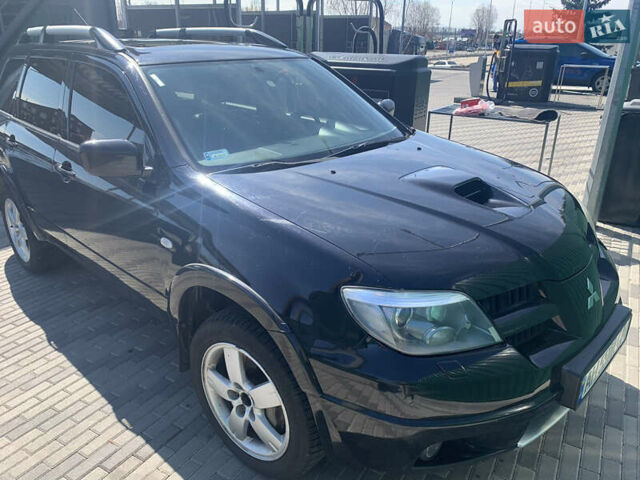 Черный Мицубиси Аутлендер, объемом двигателя 2 л и пробегом 212 тыс. км за 6000 $, фото 27 на Automoto.ua