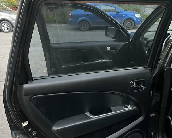 Чорний Міцубісі Аутлендер, об'ємом двигуна 2.38 л та пробігом 247 тис. км за 5499 $, фото 56 на Automoto.ua