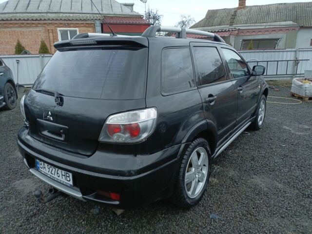 Черный Мицубиси Аутлендер, объемом двигателя 2 л и пробегом 200 тыс. км за 5100 $, фото 15 на Automoto.ua