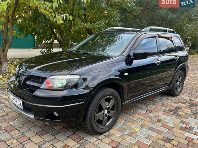 Чорний Міцубісі Аутлендер, об'ємом двигуна 2.38 л та пробігом 247 тис. км за 5499 $, фото 7 на Automoto.ua