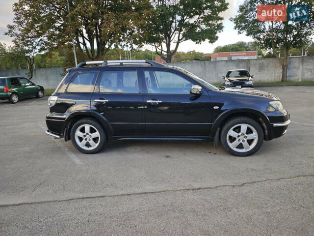 Чорний Міцубісі Аутлендер, об'ємом двигуна 2 л та пробігом 207 тис. км за 6900 $, фото 3 на Automoto.ua