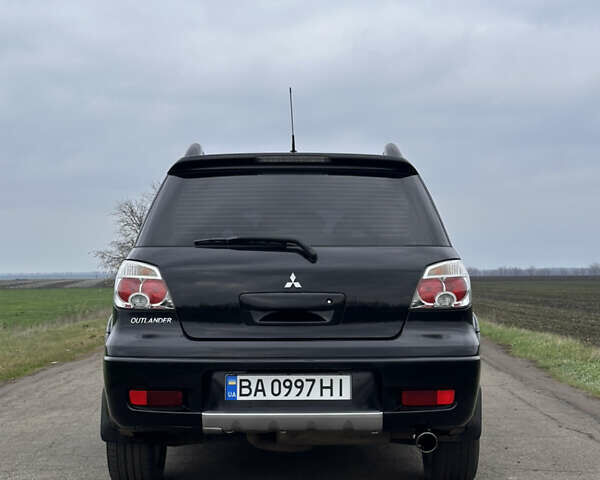 Черный Мицубиси Аутлендер, объемом двигателя 2 л и пробегом 230 тыс. км за 6300 $, фото 3 на Automoto.ua