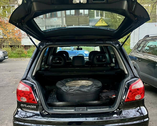 Чорний Міцубісі Аутлендер, об'ємом двигуна 2.38 л та пробігом 247 тис. км за 5499 $, фото 18 на Automoto.ua