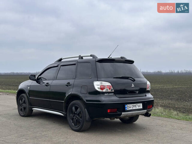 Черный Мицубиси Аутлендер, объемом двигателя 2 л и пробегом 230 тыс. км за 6300 $, фото 2 на Automoto.ua
