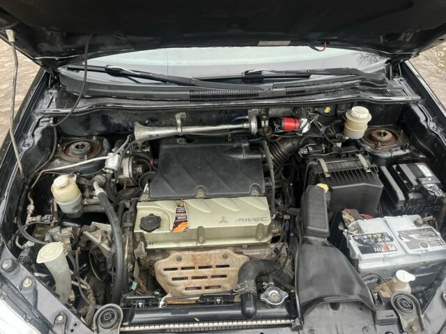 Черный Мицубиси Аутлендер, объемом двигателя 2.4 л и пробегом 310 тыс. км за 5300 $, фото 6 на Automoto.ua