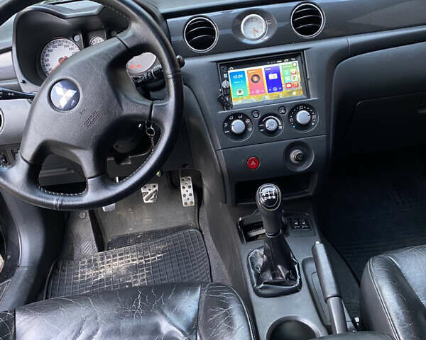 Міцубісі Аутлендер 2006 у Конотопе на Automoto.ua Чорний Міцубісі Аутлендер, об'ємом двигуна 2 л та пробігом 257 тис. км за 5800 $, фото 4 на Automoto.ua