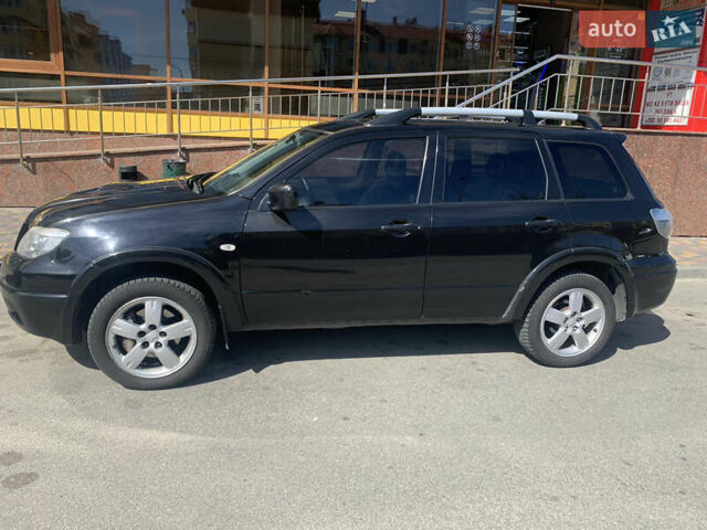 Черный Мицубиси Аутлендер, объемом двигателя 2 л и пробегом 212 тыс. км за 6000 $, фото 4 на Automoto.ua