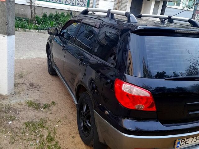 Черный Мицубиси Аутлендер, объемом двигателя 2 л и пробегом 226 тыс. км за 7000 $, фото 4 на Automoto.ua