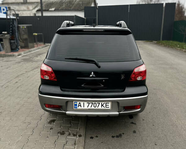 Чорний Міцубісі Аутлендер, об'ємом двигуна 2 л та пробігом 297 тис. км за 6200 $, фото 3 на Automoto.ua