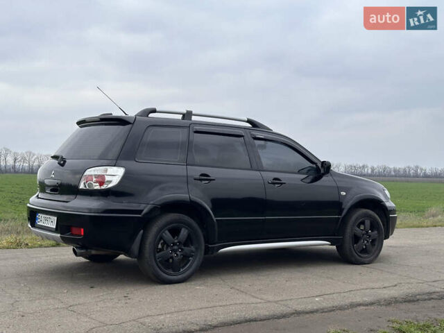 Черный Мицубиси Аутлендер, объемом двигателя 2 л и пробегом 230 тыс. км за 6300 $, фото 4 на Automoto.ua