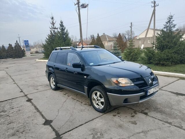 Черный Мицубиси Аутлендер, объемом двигателя 2 л и пробегом 169 тыс. км за 3500 $, фото 3 на Automoto.ua