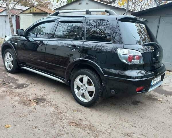 Черный Мицубиси Аутлендер, объемом двигателя 2.4 л и пробегом 256 тыс. км за 6900 $, фото 3 на Automoto.ua