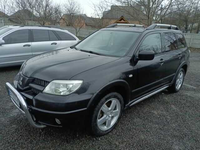 Черный Мицубиси Аутлендер, объемом двигателя 2 л и пробегом 200 тыс. км за 5100 $, фото 11 на Automoto.ua