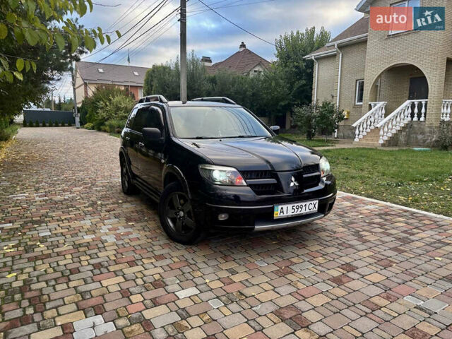 Чорний Міцубісі Аутлендер, об'ємом двигуна 2.38 л та пробігом 247 тис. км за 5499 $, фото 34 на Automoto.ua