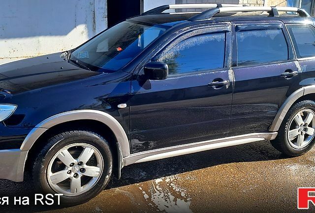 Черный Мицубиси Аутлендер, объемом двигателя 2.4 л и пробегом 185 тыс. км за 7500 $, фото 9 на Automoto.ua